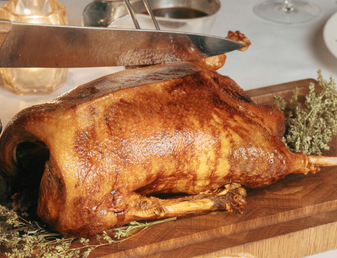 Festive roast goose with traditional side dishes served