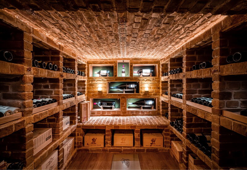 Centred view of a wall of the wine cellar