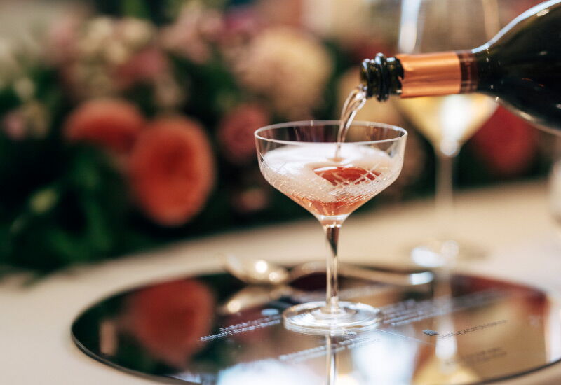 Champagne is poured into a glass