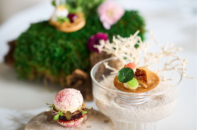 Elegant dessert presentation from Restaurant Haerlin*** on a white table.
