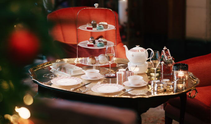 Festive afternoon tea at Hotel Vier Jahreszeiten Hamburg with pastries and Christmas decoration.